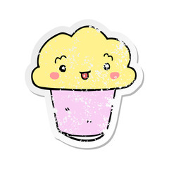 distressed sticker of a cartoon cupcake with face