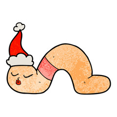 textured cartoon of a worm wearing santa hat