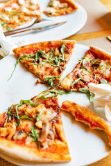 friends eating pizza in a indoor cafe
