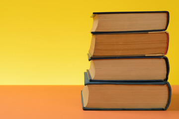 Vintage Books on Colored Paper Background.