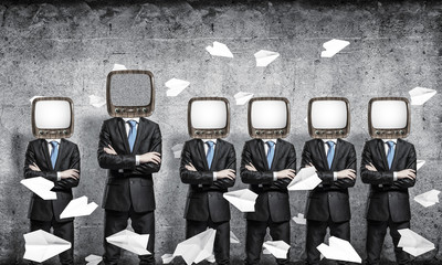 Businessmen with old TV instead of head.