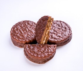 Round cookies with white chocolate filling on white background