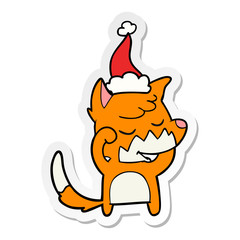 friendly sticker cartoon of a fox waking up wearing santa hat
