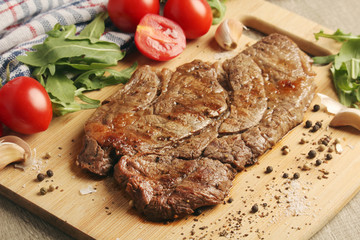 A beef steak well done with vegetables