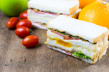 Poached eggs sandwich for breakfast on table