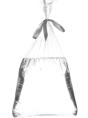 Empty transparent packaging bag filled with water and air on a white background