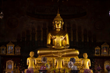 The golden Buddha statue is located in the church.