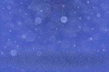 blue fantastic bright glitter lights defocused bokeh abstract background and falling snow flakes fly, festive mockup texture with blank space for your content