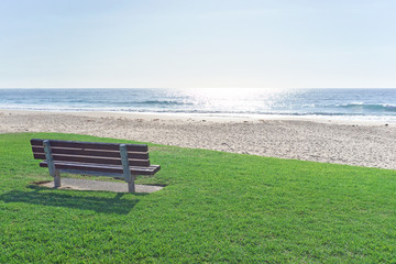 Naklejka na ściany i meble park bench at the beach