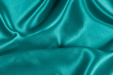 Closeup of rippled light blue satin fabric