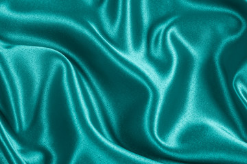 Closeup of rippled light blue satin fabric