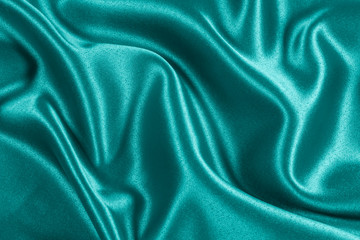 Closeup of rippled light blue satin fabric