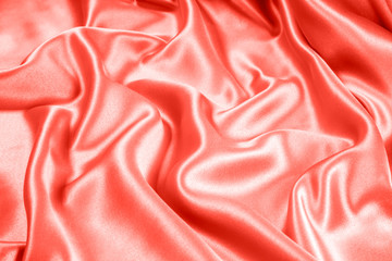 Fototapeta premium Closeup of rippled coral satin fabric