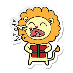 sticker of a cartoon roaring lion with gift