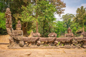 Preah Khan temple, Cabodia: Causeway with railings depicting Churning of the sea of milk of khmer mythology