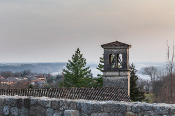Obraz premium Sunset on the ancient castle of Ragogna, Italy. Fortress guarding the ford on the river Tagliamento