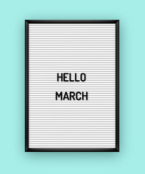 Hello March motivation quote on white letterboard with black plastic letters