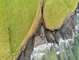 This is an aerial view of the entrance to a sea cave on the Donegal coast in Ireland.