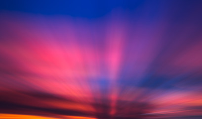 sunrise rays through the clouds, motion blur