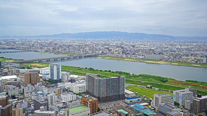 Obraz premium Japan Osaka city, buildings, river and bridge from aero view