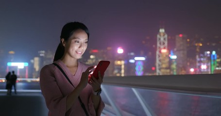 Woman use of mobile phone at night