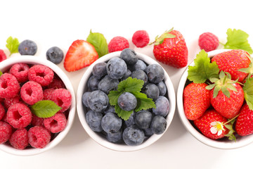 strawberry, blueberry and raspberry isolated on white background