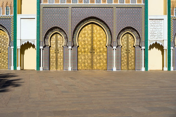 Brass gate and zellige mosaic tilework on Dar al-Makhzen or Dar el-Makhzen royal palace in Fez, Morocco