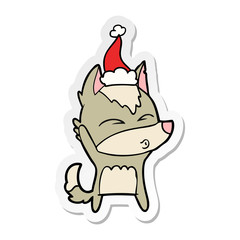 sticker cartoon of a wolf whistling wearing santa hat
