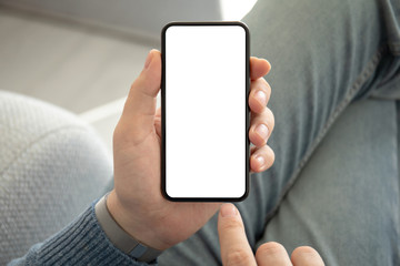 man in jeans holding phone with an isolated screen © DenPhoto