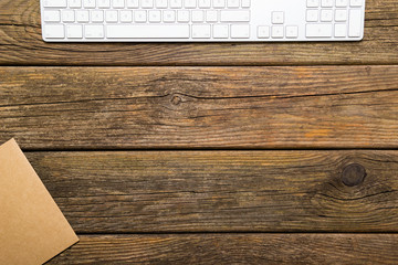 place of work, recycled paper,keypad, old wooden table background