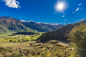 Naklejka na ściany i meble Rocky Mountain and Diamond Lake in the Mt Aspiring National Park, Wanaka, New Zealand