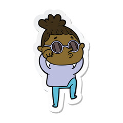 Obraz premium sticker of a cartoon woman wearing sunglasses
