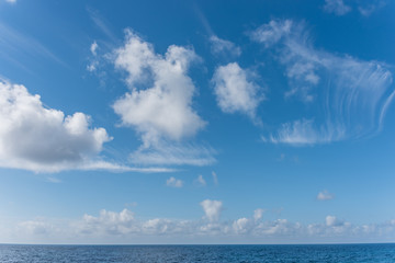 Naklejka na ściany i meble Cloudscape Over the Blue Southern Mediterranean Sea Coast