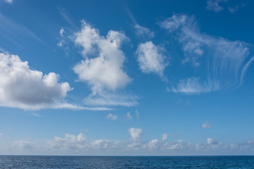 Naklejka na ściany i meble Cloudscape Over the Blue Southern Mediterranean Sea Coast