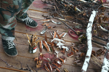 Harvesting chips and bark for a fire in rainy weather. Production of a torch by means of a tin can....