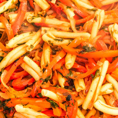 Rustic Italian vegetarian pasta peperonata - casarecce pepper close-up, food background.
