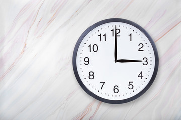 Wall clock show three o'clock on marble texture. Office clock show 3pm or 3am on marble texture...