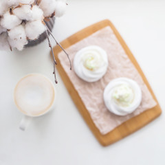 Low-calorie dessert Pavlova with a cup of coffee