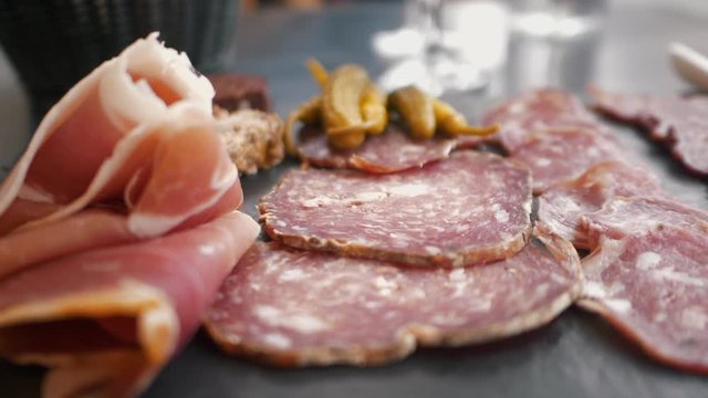 Charcuterie French sausage salami pate plate food slow motion