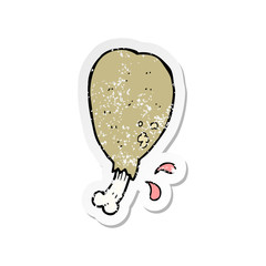 retro distressed sticker of a cartoon chicken leg