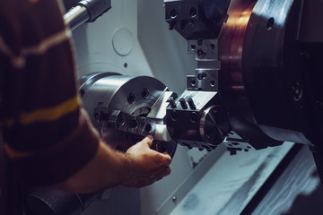 Fototapeta na wymiar Close up CNC milling machine working process on metal industry 