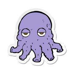 sticker of a cartoon alien squid face