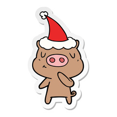sticker cartoon of a content pig wearing santa hat