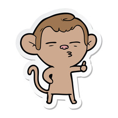 sticker of a cartoon suspicious monkey