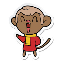 sticker of a cartoon laughing monkey