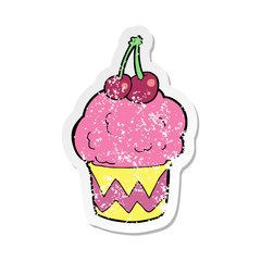 retro distressed sticker of a cartoon cupcake