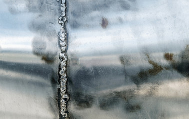 weld on a steel pipes close up