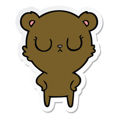 sticker of a peaceful cartoon bear