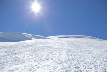 Winter mountain landscape with mountains and blue sky