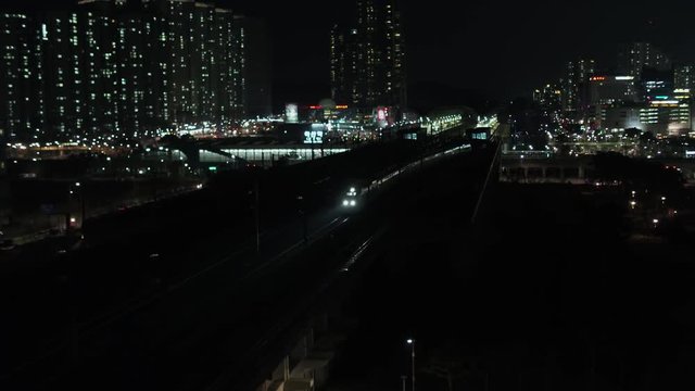 KTX, High-speed train passing through the station, night scenery, drone shot